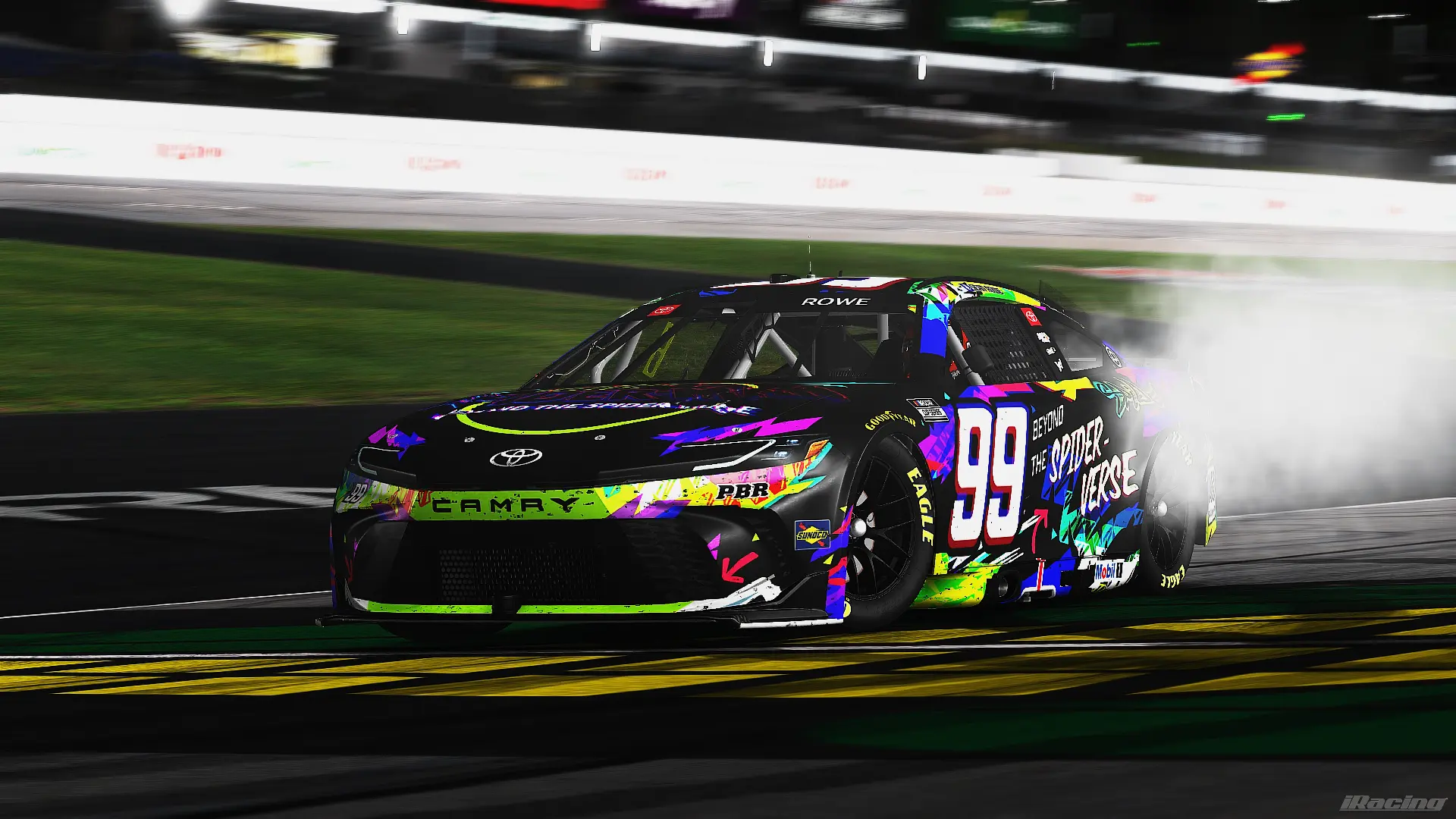 The #99 Spider-Verse Camry sliding sideways in tire smoke at night
